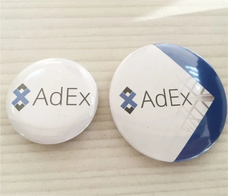 Значки тип копче с AdEx бранд лого — два размера
